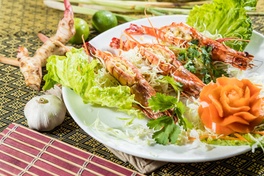 Curry glazed skewers on floral plate