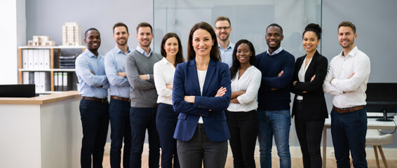 Obraz premium Property manager leads diverse residential management team, highlighting leasing, tenant services, maintenance coordination, property administration and professional real estate operations.