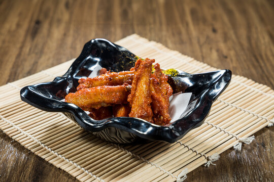 Spicy sauced chicken wings in bowl