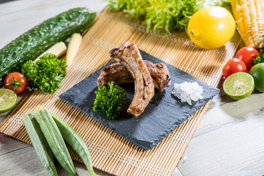 Grilled pork ribs with sea salt garnish