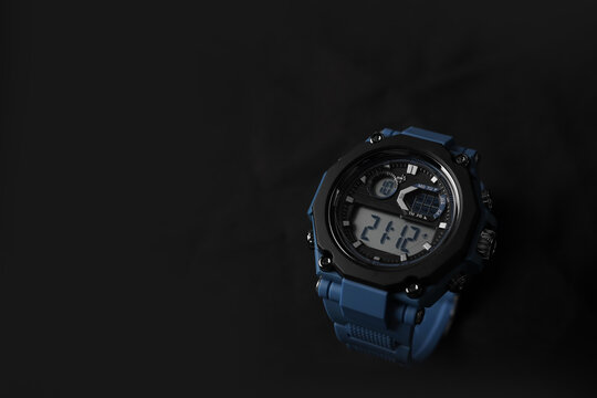 Modern Black and Blue Digital Sports Watch on Dark Background with Copy Space
