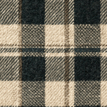 Seamless pattern warm wool fabric texture showing a close up view of a classic checkered plaid pattern, providing a cozy textile background