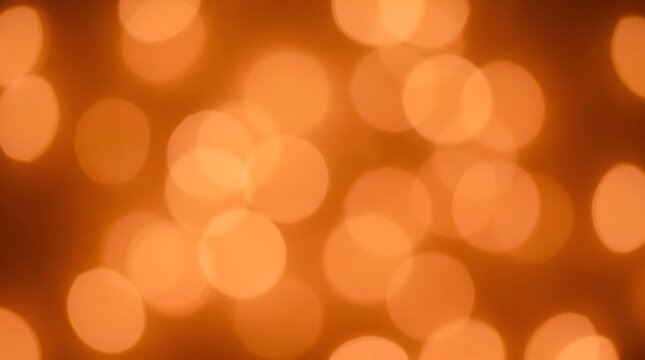 Abstract background with soft orange glowing bokeh circles abstract background defocused wallpaper artistic aesthetic brighten