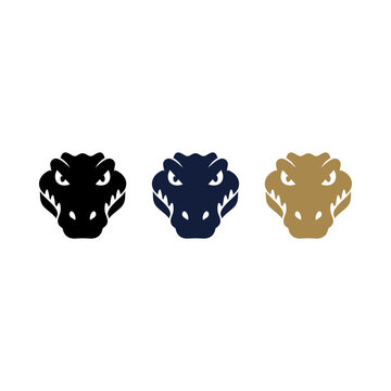Set of three stylized crocodile head logos in black blue and gold colors.