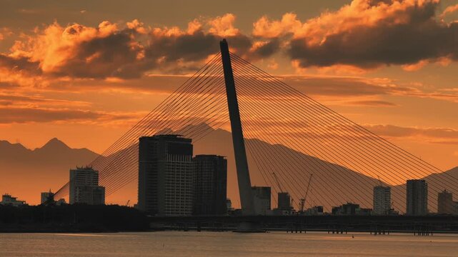 Tran Thi Ly Bridge Skyline Over Han River at Sunset with cityscape silhouettes 
