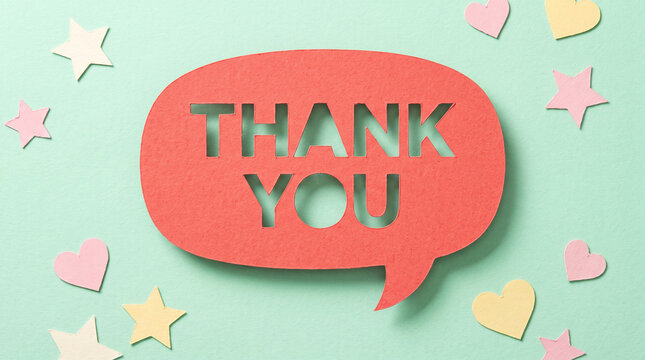 Paper cut speech bubble with thank you text on green background