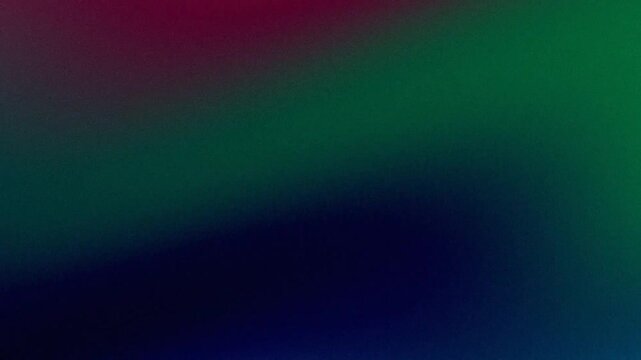 Grainy abstract background with dark red, green and blue gradient.