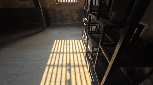 26 Geometric window shadow on stone floor in old chinese manor study room