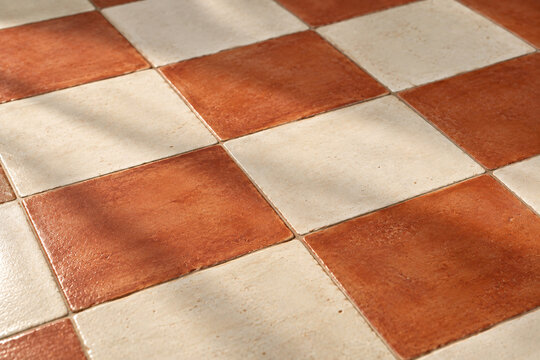 Terracotta and Cream Hand-Painted Checkerboard Tile Pattern