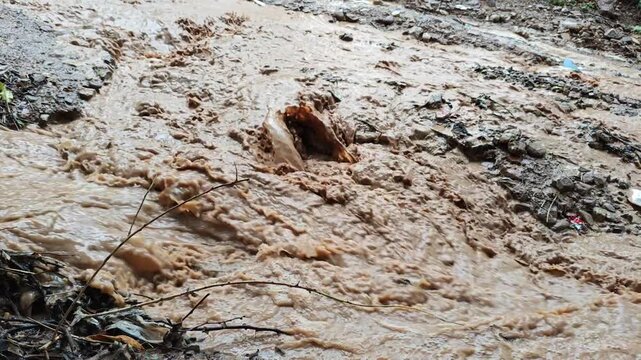 Small Dirty Water Trickle Running Slowly Through Earth Creek