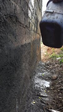 Wetting Wall Surface with Water to Improve Cement Plaster Adhesion