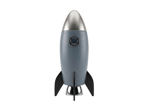 Gray metallic rocket model on launchpad