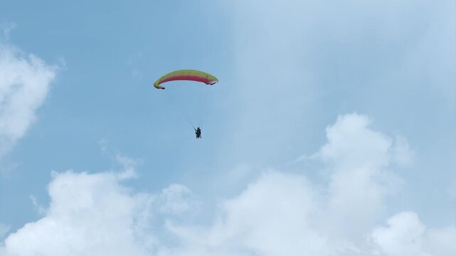 Flying Paraglider on a Background of the Sun and Beautiful Clouds  in  Manali , India .