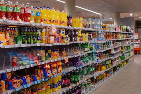 August 20, 2026, Amsterdam, Netherlands - Aisle of soft drinks and beverages in an Albert Heijn XL supermarket