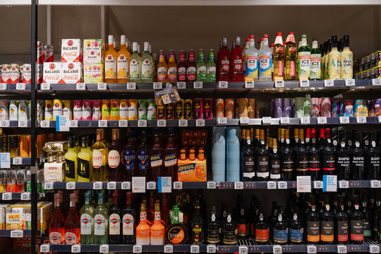 August 20, 2026, Amsterdam, Netherlands - Shelves stocked with various alcoholic beverages in an Albert Heijn XL supermarket