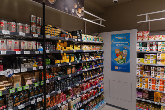 August 20, 2026, Amsterdam, Netherlands - Coffee and tea products on shelves at Albert Heijn XL supermarket
