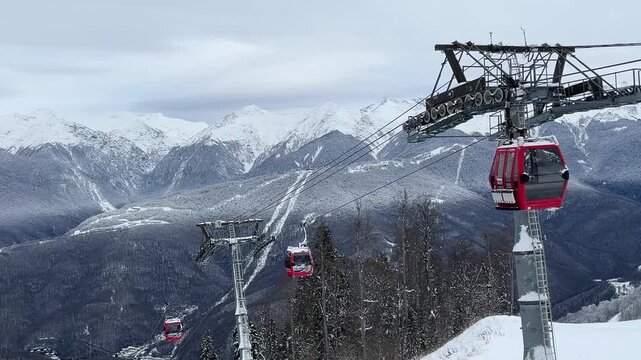 Snow-covered mountains with ski lifts and gondolas. The scene captures a winter sports environment, showcasing the beauty of nature in a cold climate.