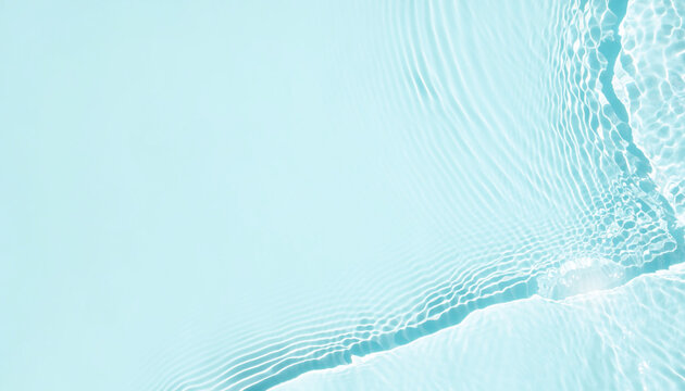 Pale aqua water background with sunlight caustics and copy space
