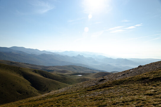 mountain landscape with blue sky and rolling hills