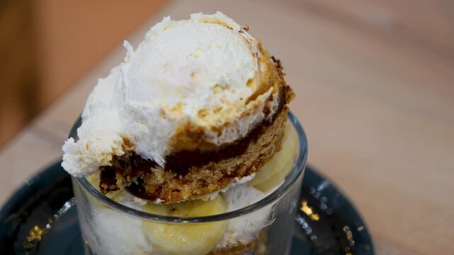 Banoffee with banana and caramel sauce in cafe restaurant