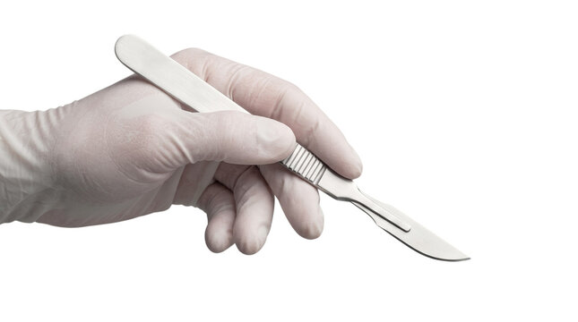 Gloved hand holding a sharp medical scalpel for surgical procedures