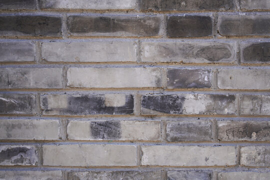 Weathered Brick Wall with Distressed Appearance