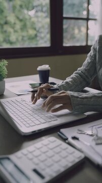 A real estate professional reviews and signs a property agreement, representing a home purchase, mortgage approval, investment, and legal transaction.
