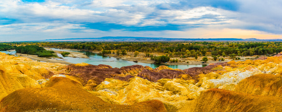 Colorful Beach, also known as Wucaitan, in Burqin County, Altay Prefecture, Xinjiang, China. The scenic landscape features colorful Yardang rock formations along the Irtysh River, surrounded by a




