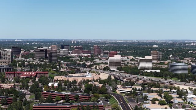 Aerial of Greenwood Village Colorado Denver Tech Center along Interstate 25 with multistory office buildings and retail centers in summer