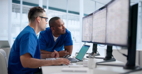 Doctor And Nurse Review Patient Data Together