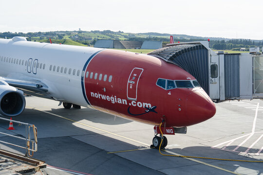 August 19, 2026, Stavanger, Norway - Norwegian.com Boeing 737 aircraft parked at an airport gate