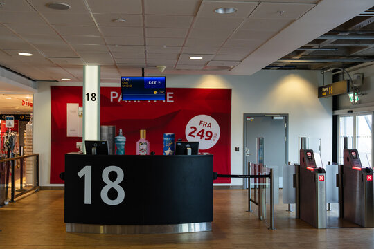 August 19, 2026, Stavanger, Norway - Airport gate 18 with SAS flight information screen and duty-free display