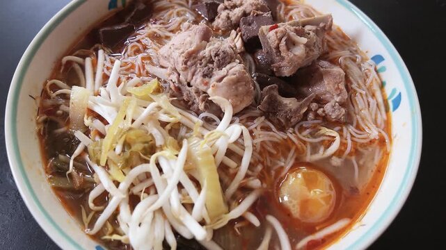 Slow Motion of Steaming Khanom Jeen Nam Ngiao Northern Thai Noodle Soup