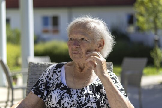 Thoughtful 86-year-old woman, retirement home, Jettingen, Baden-W&uuml;rttemberg, Germany