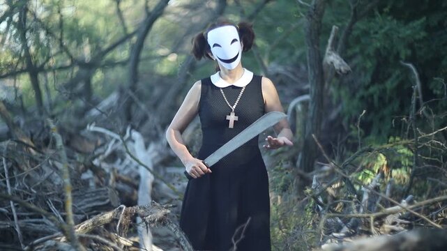 Creepy character with saw for Halloween in spooky forest