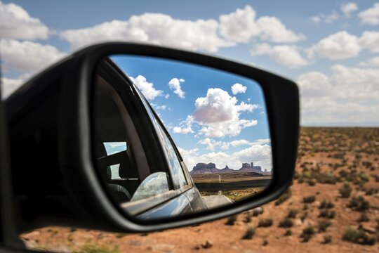 Look into the rear-view mirror of a car, Highway 163 and Monument Valley, Mexican Hat, Utah, USA