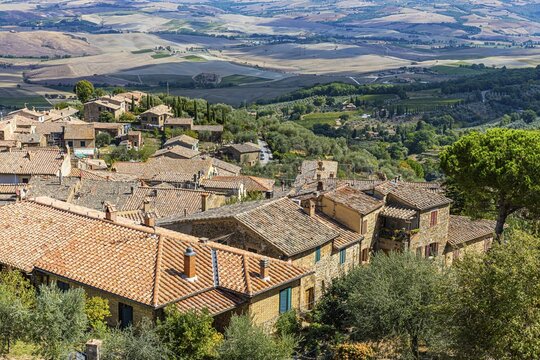 Above the rooftops of Montalcino, view of the Val dOrcia valley, from the Rocca di Montalcino fortress, Montalcino, Tuscany, Italy