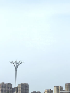 Apartment Buildings and Modern Streetlight Under Clear Sky