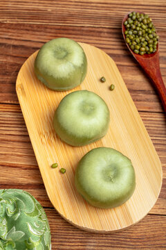 Green Mung Bean Cakes on Bamboo Board