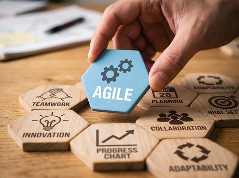 Agile Methodology Concept with Hand Placing Blue Hexagon Puzzle Piece Labeled Agile Among Icons for Teamwork Innovation Collaboration Adaptability and Progress Chart on Wooden Background