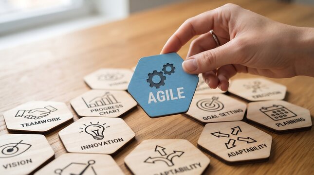 Person holding wooden hexagon tile with agile methodology icon on wooden desk wooden tiles project management business strategy process improvement business icons