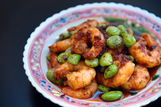 Spicy shrimp with stink beans and chili paste on decorative plate