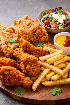 Peruvian dish "Pollo Broaster" (Fried Chicken) with fries and salad