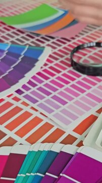Color matching process with paint swatches on a table