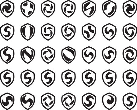 Shield icons collection black shapes with varied geometric spiral and letter s patterns representing security status and identity.