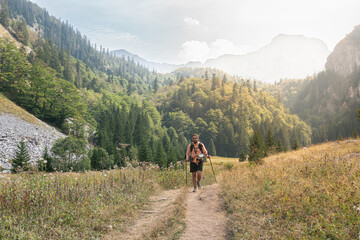 Fototapeta premium Young man hiking through Sutjeska National Park in Bosnia and Herzegovina during daylight