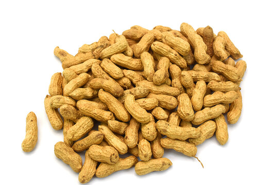 Pile of Raw peanuts in shell isolated on white background