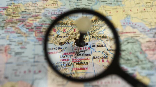 Magnifying glass reveals Damaskus on paper map