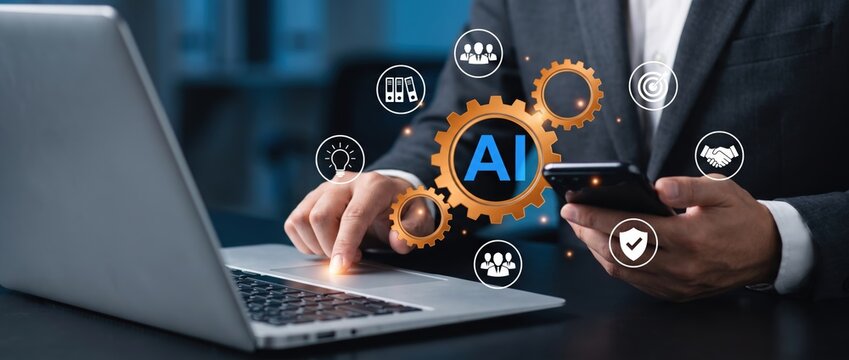 Business professional engaged with a smartphone and laptop featuring ai icons and gear graphics that illustrate the integration of technology in today's work setting.