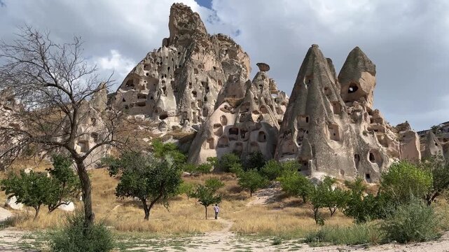 Ancient houses made in tuff rocks near Uchisar Castle in Cappadocia, Turkey.